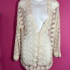 Open knit/ crochet cardigan.